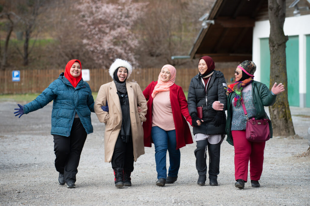 group-of-muslim-friends-walking-and-laughing-toget-2026-01-11-10-42-53-utc